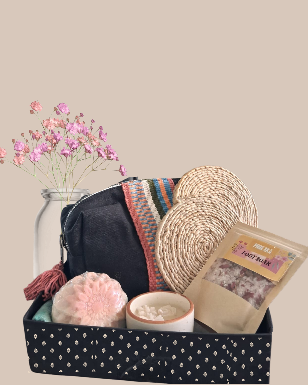 Luxury handcrafted wedding and event hamper by The 369 Gift Company — stiff lotus trunk box with paper grass bed and greeting card, including Urli Oudh candle, festive tealight holders, mini Diya box, resin shimmer coasters, Jasmine bath salt blend, Ferrero Rocher, healthy date bites, and German silver elephants. Perfect for weddings, events, and festive gifting.