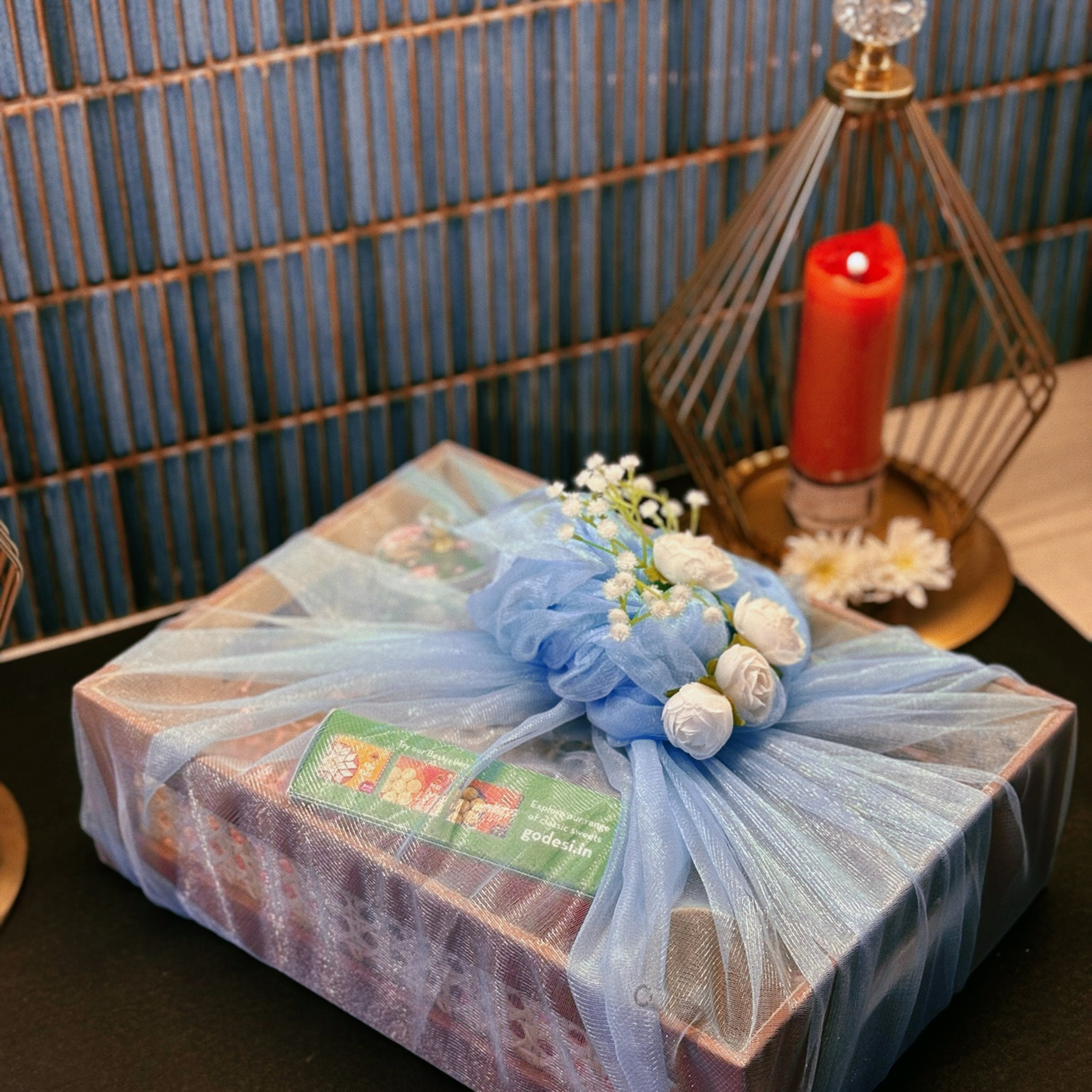 Luxury handcrafted wedding and event hamper by The 369 Gift Company — featuring a rattan tray with mocha leather detailing, Mysore pak, Urli Oudh candle, elephant tealight holders, nuts and seed-filled Pichwai metal jar, festive mints, rainbow crochet charm, starter bowls, and glass coffee tumbler — perfect for wedding favours, event gifting, and festive celebrations.